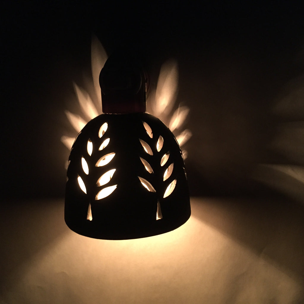 round nightlight with white outlined leaf design